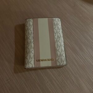 Michael Kors travel wallet.